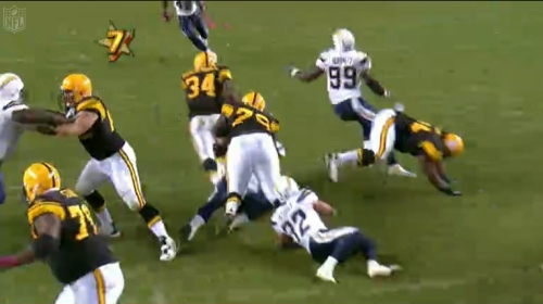 Mendenhall has his head back up now has broken the tackle and is off to the open field.