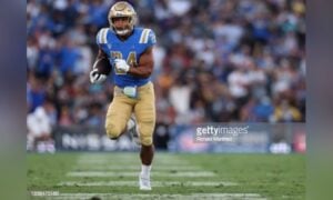 Southern California safety Isaiah Pola-Mao (21) tackles UCLA wide receiver Kyle  Philips (2) dur …