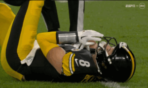 Jack Lambert of the Pittsburgh Steelers tackles Lydell Mitchell of